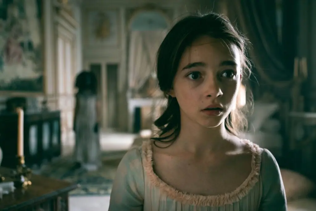 Still from Netflix’s La Révolution, close-up of a young aristocratic deaf girl's face looking afraid