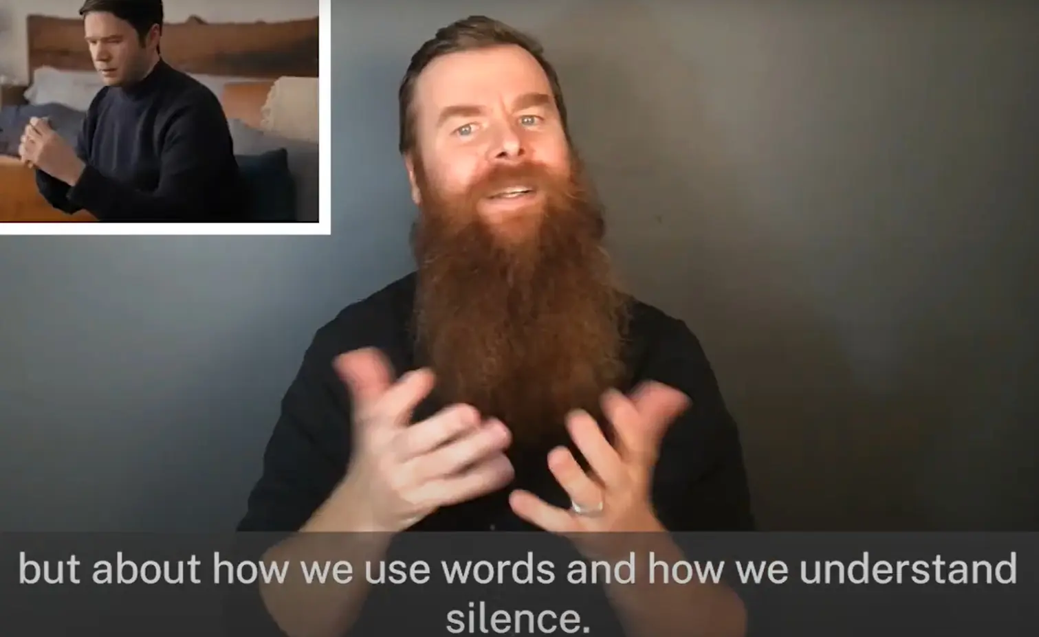 Man signs against background with film clip of another man superimposed in top left corner and the caption "how we use words and how we understand silence."